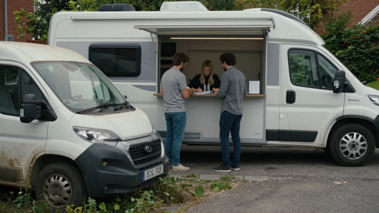 A modern rented campervan at a rental counter, beside an abandoned van in a weedy driveway.