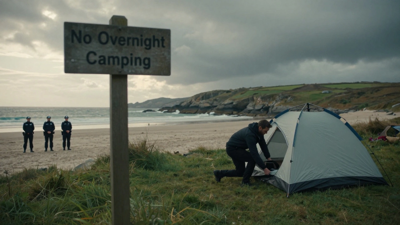 Camper packing up tent as police approach on English beach